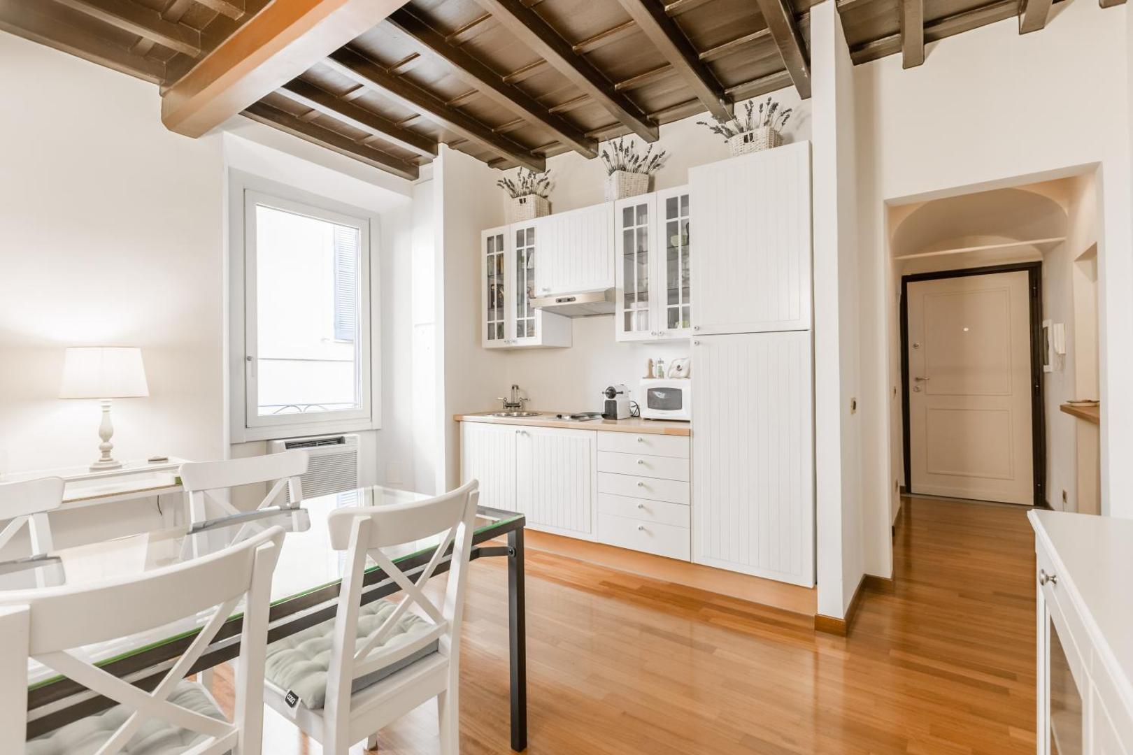 The kitchen, opening onto the dining table
