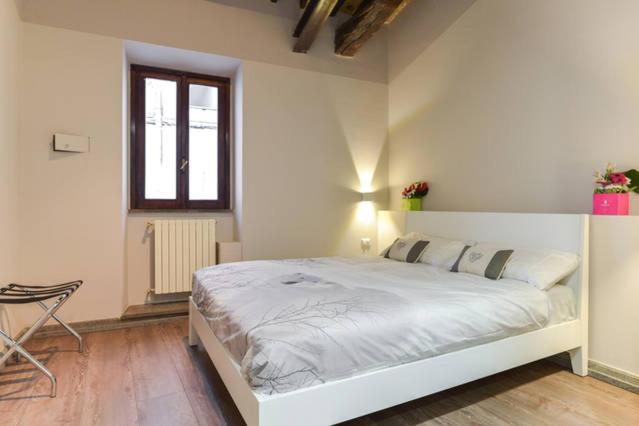 The main-level bedroom, with a window onto the lane