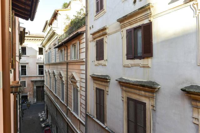 The view from the window, over the roofs and facades of Vicolo del Governo Vecchio