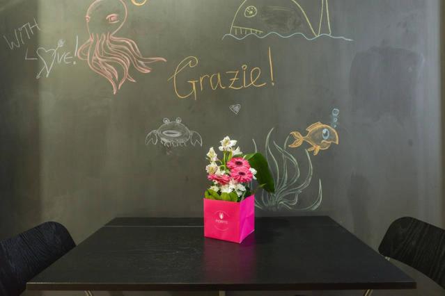 A chalkboard and fresh flowers in the kitchen